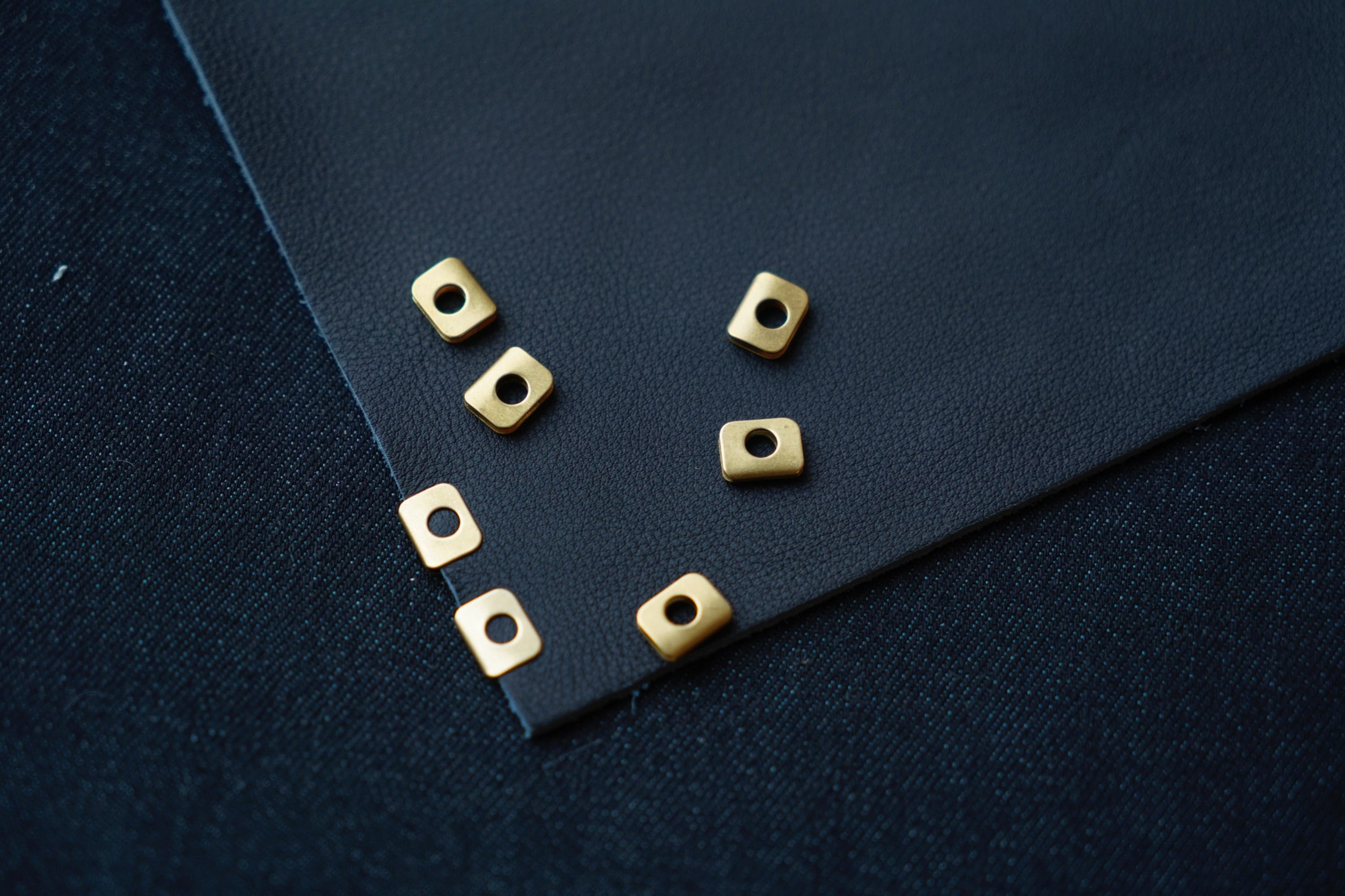 golden clasps and leather